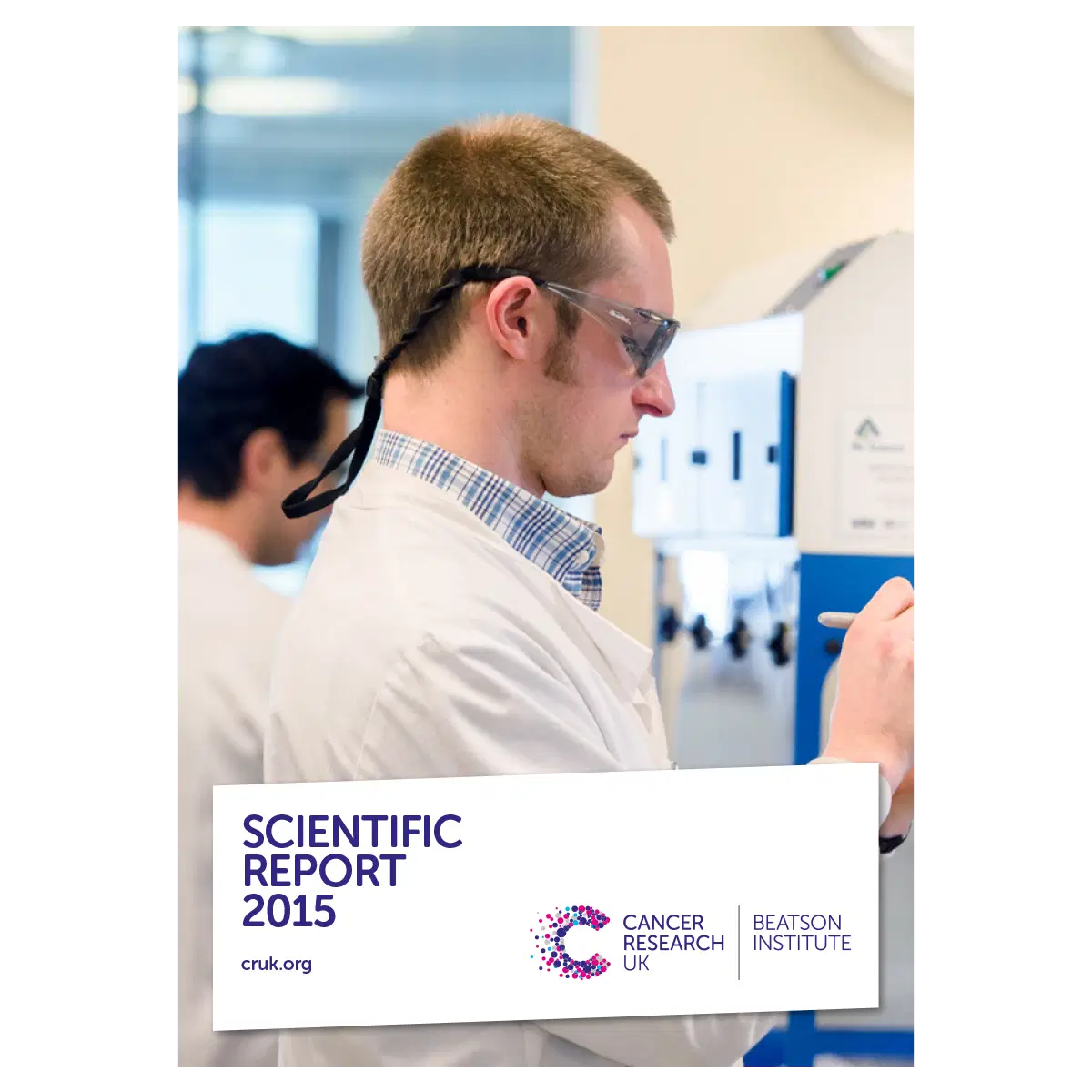 A male scientist in a white lab coat and safety glasses works in a laboratory. The image is overlaid with a banner reading Scientific Report 2015, Cancer Research UK, Beatson Institute.